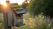 © SashaMagic - Aging mossy birdhouse on post in wildflower meadow during golden hour, serene nature scene with copy space