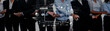 © InfiniteFlow - A diverse group of professionals in business attire collaborates with a digital interface, symbolizing teamwork, innovation, and professional growth in a corporate environment. Trope