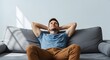 © 2 Mister Toya - Relaxing man resting head on sofa looking upwards at sun