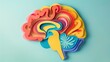 © Avaleart - Colorful paper cut brain on light blue background.