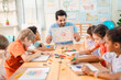 © chokniti - Back to school and education concept of teacher children classroom drawing art school education lesson table paper