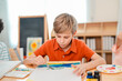 © chokniti - Back to school and education concept of child painting art class boy student paint brush canvas creative indoor education