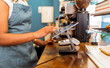 © PintoArt - Employee using tablet for a digital point of sale