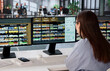 © Andrey Popov - Young Retail Manager Uses Software On Computer