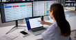 © Andrey Popov - Woman Uses Multiple Screens Analyzing Supplier Data