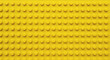 © Nahnuddin - Yellow plastic building block plate texture background for kids toys
