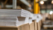 © photo for everything - Close-up stack of raw paper sheets with brown cardboard layer in an industrial warehouse facility for printing or packaging production