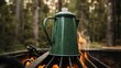 © Mariela - Hot coffee brewing on a camping grill at sunset, elevated outdoor cooking scene with steaming enamel mug and fire glow, cozy nature adventure concept, rustic camping atmosphere.