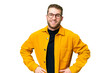 © luismolinero - Young handsome blonde man over isolated chroma key background posing with arms at hip and smiling