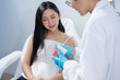 © NINENII - Dentist examining oral health, dental checkup and treatment.