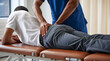 © sdazfdgtxg - Physical Therapist or Chiropractor Treating Lower Back and Hip Pain of Male Patient on Massage Table