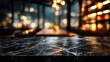 © fandi - Empty Marble Tabletop with Blurred Restaurant Background at Night.