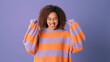 © Andrii Nekrasov - Joyful Woman Posing In Striped Orange Purple Sweater