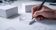 © Saifull - Hand sketching box designs, white boxes present
