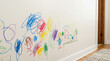 © Xenia - Colorful child crayon drawings and scribbles on a white wall. Messy kids art on an interior household surface
