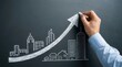 © Paul - Concept of business development and growth illustrated by drawing buildings and an arrow on a chalkboard.