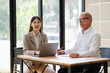 © David - Business professionals discussing work in a modern office environment