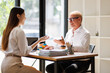 © David - Diverse business professionals discussing work during a meeting