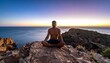 © Juni - Man meditating on rocky cliff at sunset overlooking ocean waves