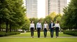 © M Yoga Febriano - Business professionals walking together in a park surrounded by trees and buildings