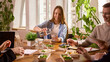 © master1305 - Coworkers sharing healthy lunch during office break in bright workspace. Concept of corporate catering, employee wellness programs, office meal service and food delivery advertising.