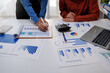 © groviapoto - Financial Businesswomen analyze the graph of the company's performance to create profits and growth, Market research reports and income statistics, Financial and Accounting concept.