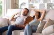 © PheelingsMedia - Stressed couple suffering heat stroke in a house interior