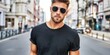 © NovaVision - Stylish man with sunglasses and beard walking on a city street in a black t-shirt