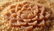 © Future Vision - Capturing layered brown sugar rosette glowing on kitchen counter with loose crystals dusting petals