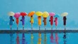© Ratna - Vibrant figures with colorful umbrellas reflect on a wet, blue surface