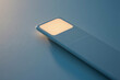© Design Mart - Close up of glowing light on modern blue device surface