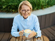 © Lumos sp - Portrait of a middle aged mature businesswoman woman drinking a cappuccino in a coffee shop