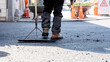 © ADDICTIVE STOCK - Workers paving asphalt on urban city street