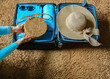© Iryna - Close up woman packing suitcase to vacation  getting ready to travel trip. Concept of summer vacation trip. Brown blue colors.