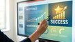 © imagemir - Hand pointing at screen with success chart and star graphic