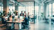 © MOHAMMADELIUS - Modern open plan office interior with business people working and collaborating at desks, blur effect with professional corporate atmosphere.