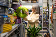 © Ivan Traimak - Woman shopping for home and garden supplies in a retail hardware shop