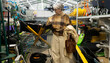© Ivan Traimak - Senior woman is looking at a wheelbarrow in a large hardware and garden store