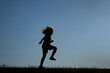© Volodymyr - Kid silhouette jumps in sunlight. Energetic kid enjoys summer outdoors. Kid action supports active lifestyle. Kid movement feels fun and free.