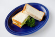 © 勇亮 吉田 - Tuna Salad Sandwiches on Blue Plate over White Background
