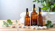 © SolaruS - Serene spa setup with amber essential oil bottles, fresh eucalyptus, and smooth white pebbles on wood. Ideal for natural skincare marketing, holistic health, and relaxation concepts.