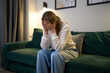© Sergey Mironov - Woman sitting in emotional exhaustion at home