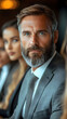 © studio - Businessman in a suit looking forward.