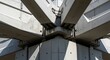 © Platon - Architectural detail of many concrete beams meeting at a pillar