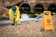 © DJ Creative Studio - Environmental Worker Inspecting Industrial Hazard Zone During Wastewater Pollution Monitoring And Environmental Safety Assessment Near Drainage Area