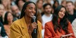 © Andrii Zastrozhnov - Smiling woman asking question with microphone at conference audience for event engagement banner and seminar background