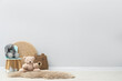 © New Africa - Child's chair and toys near light wall in room. Space for text
