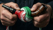 © Denys Shtaniev - Two hands grip a wooden smoking pipe that has been tied into a tight knot with a cloth featuring the Iranian flag.