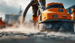 © Jack - An industrial vacuum cleaner is being used by a professional worker to vacuum dusty floors at a construction site, which is a concept for cleaning, renovation, and maintenance.
