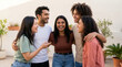 © TheLestari - Diverse group of young friends laughing outdoors